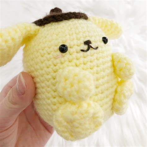 Try this crochet craft and make yourself the sweetest Pompompurin friend You can find more crochet crafts like this from The Hello Kitty Crochet Supercute Amigurumi Patterns For Sanrio Friends by Mei Li Lee. . Pompompurin crochet pattern